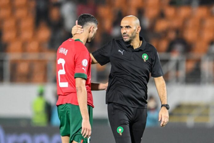 moroccos-coach-walid-regragui-r-and-moroccos-defender-2-achraf-hakimi-1706656529
